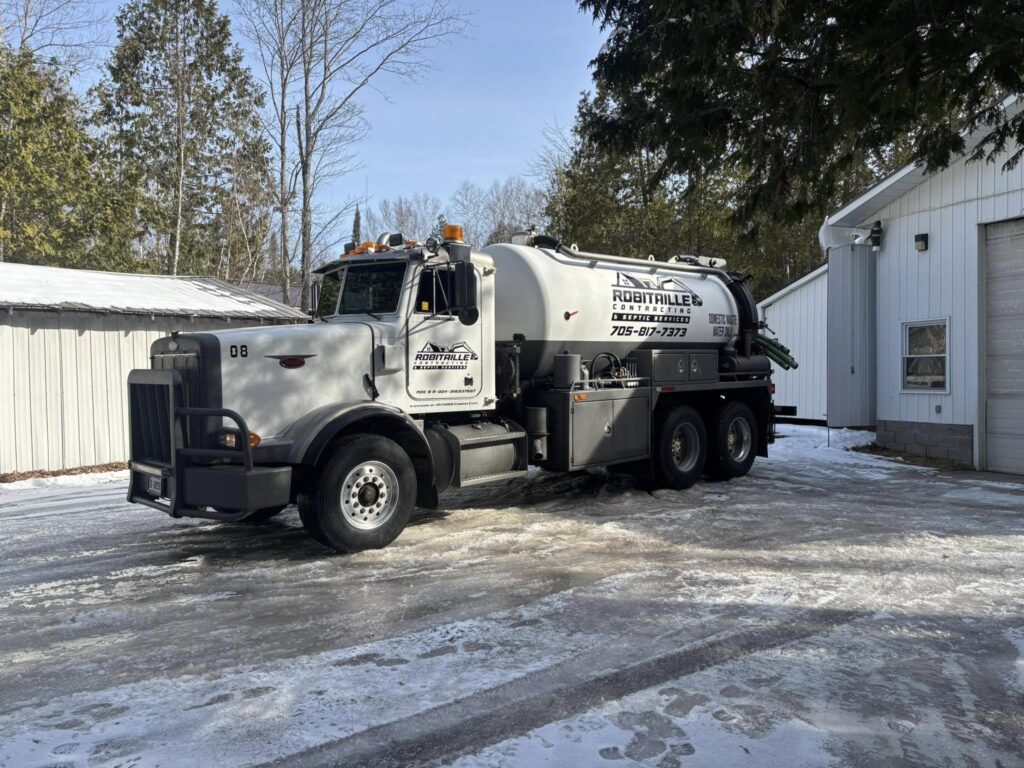 Robitaille Contracting crew performing septic pumping and installation services in Trout Creek, Astorville, or North Bay