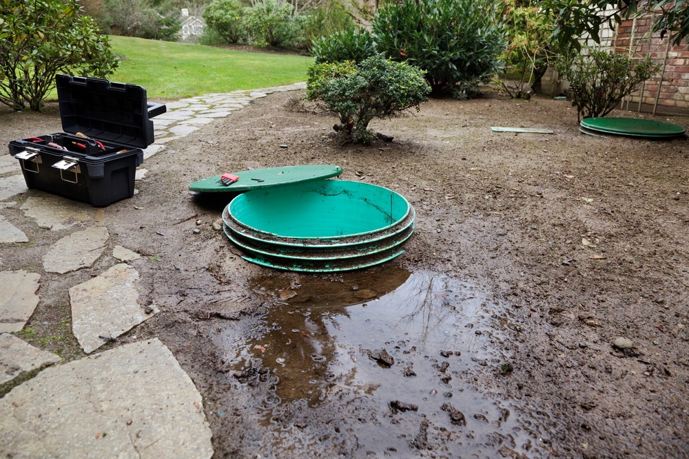 Satisfied homeowner shaking hands with a Robitaille Contracting technician after a completed septic service